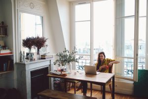 Young freelancer woman relaxing in her Parisian apartment